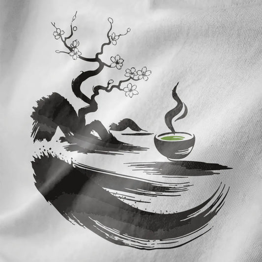 Close-up of white fabric with sumi-e twisted tree, white cherry blossoms, and green matcha bowl.