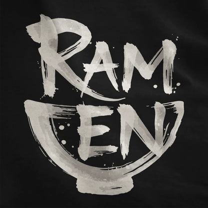 Close-up on black fabric showing expressive brushstroke ramen text shaped like a ramen bowl in monochrome palette.