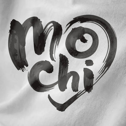 White close-up of mochi brushstroke text with heart outline on soft fabric, artistic brush strokes.