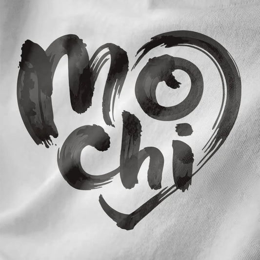 White close-up of mochi brushstroke text with heart outline on soft fabric, artistic brush strokes.