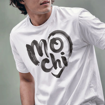 Male model wearing white t-shirt featuring expressive mochi text in brushstroke style inside heart outline.