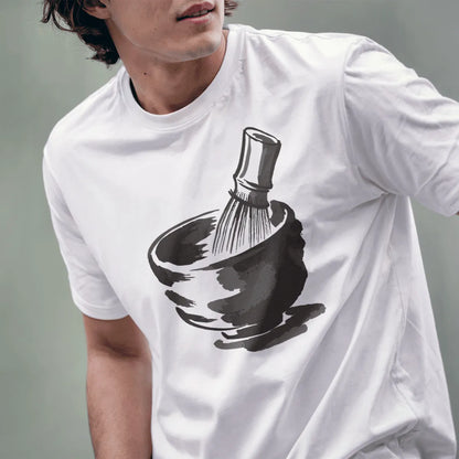 Male model in white t-shirt showing serene matcha tea bowl and bamboo whisk illustration.