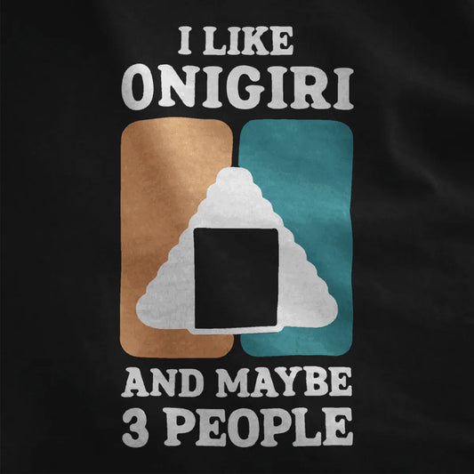 Black fabric close-up showing vibrant onigiri rice ball with seaweed square, bold text, graphic design t shirt.