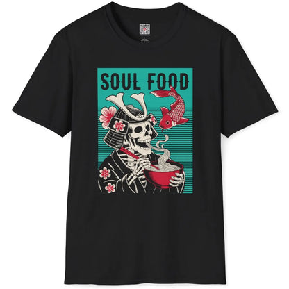 Flatlay black t-shirt displaying bold samurai skeleton ramen design with koi fish and "SOUL FOOD" text.