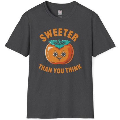 Dark heather shirt flatlay with playful vintage persimmon illustration, orange fruit with teal leaves, bold text.