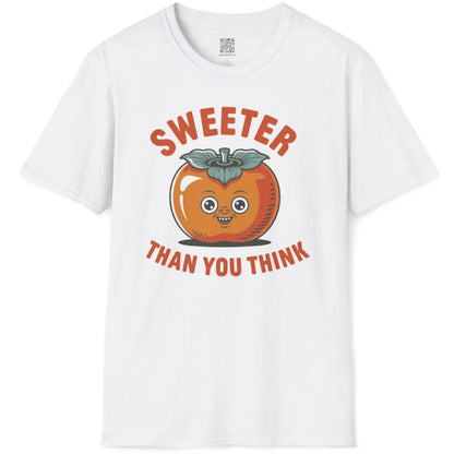 White flatlay t-shirt showing cheerful persimmon face with bold retro text, orange and teal color palette.