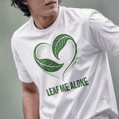 Male model in white t-shirt displays leafy heart and witty slogan, peaceful imagery and whimsical art.