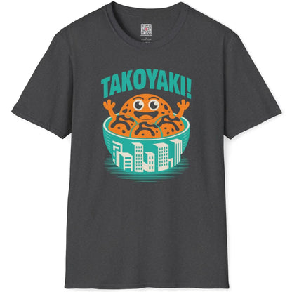 Dark heather t-shirt flatlay with whimsical takoyaki character and bold teal lettering.