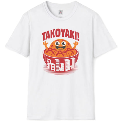 White t-shirt flatlay displaying cartoon takoyaki balls with rich sauce and urban bowl art.