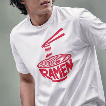 Male model wearing white t-shirt with red ramen bowl art and chopsticks holding noodles.