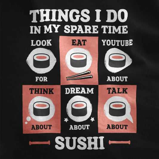 Closeup of sushi t-shirt grid pattern on black fabric, with coral and charcoal blocks and sushi illustrations.