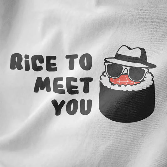 Close-up of whimsical sushi with fedora and sunglasses on white shirt, bold "RICE TO MEET YOU" text, sushi pun.