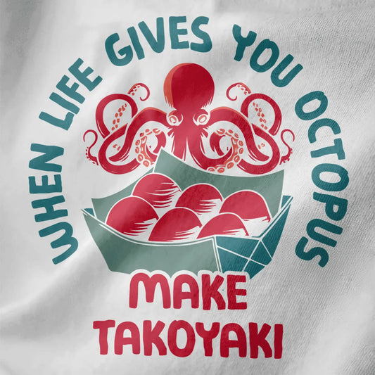 Close-up of playful octopus and takoyaki balls on white shirt, featuring circular text and vibrant style.