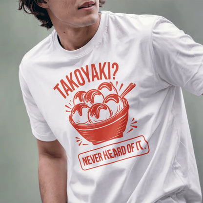 Male model wears white t-shirt with vibrant takoyaki graphic and humorous quote, showcasing streetwear style.