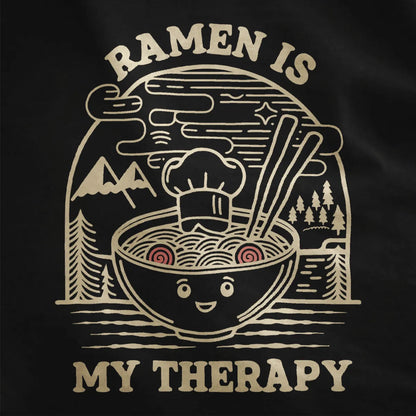 Close-up of whimsical ramen bowl graphic on black fabric, highlighting cozy food and modern tradition.