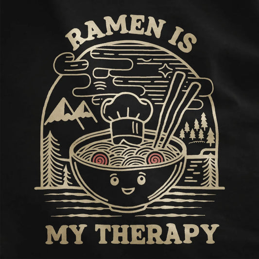 Close-up of whimsical ramen bowl graphic on black fabric, highlighting cozy food and modern tradition.
