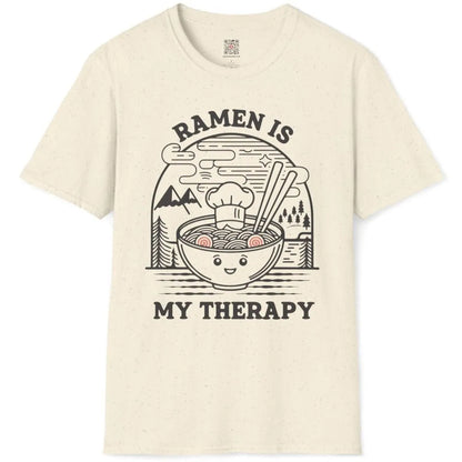 Natural t-shirt flatlay with cheerful ramen bowl and "RAMEN IS MY THERAPY" text, cozy food, pastel aesthetics.
