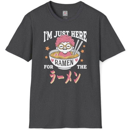 Dark heather shirt flatlay with pink-haired character peeking from ramen bowl, ramen t-shirt, bold typography.