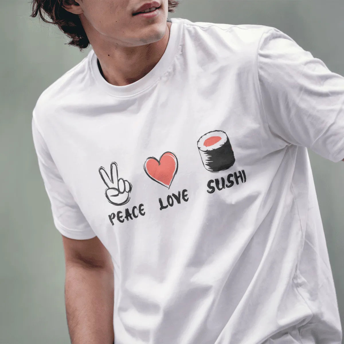 Male model wearing white t-shirt with playful Peace, Love, Sushi design featuring sketch-style icons.