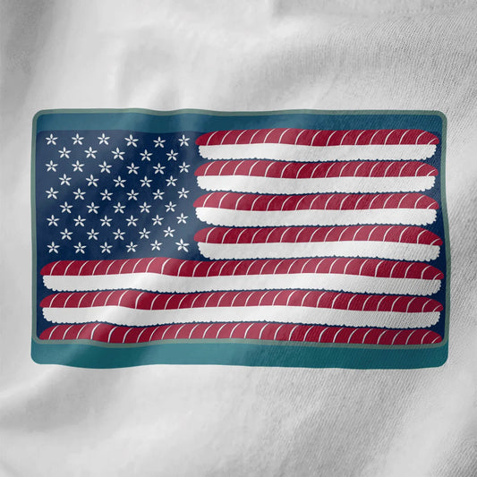 American flag reimagined with sushi rolls and white flowers on white shirt, fusion cuisine, sushi t-shirt.