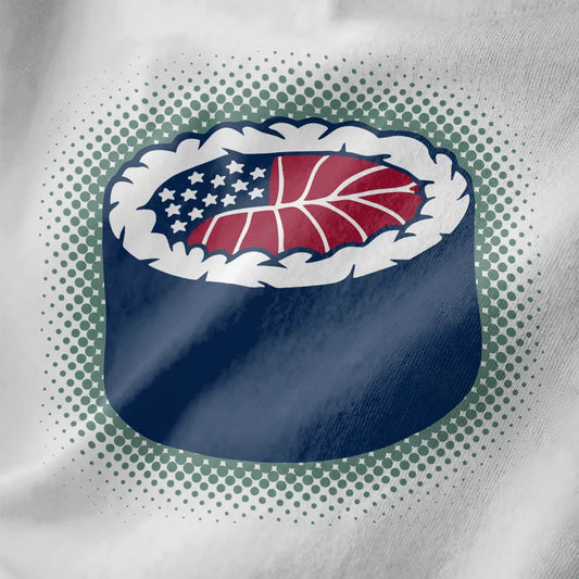 Close-up of sushi roll with American flag top on white shirt; fusion cuisine, sushi t-shirt, bold design.